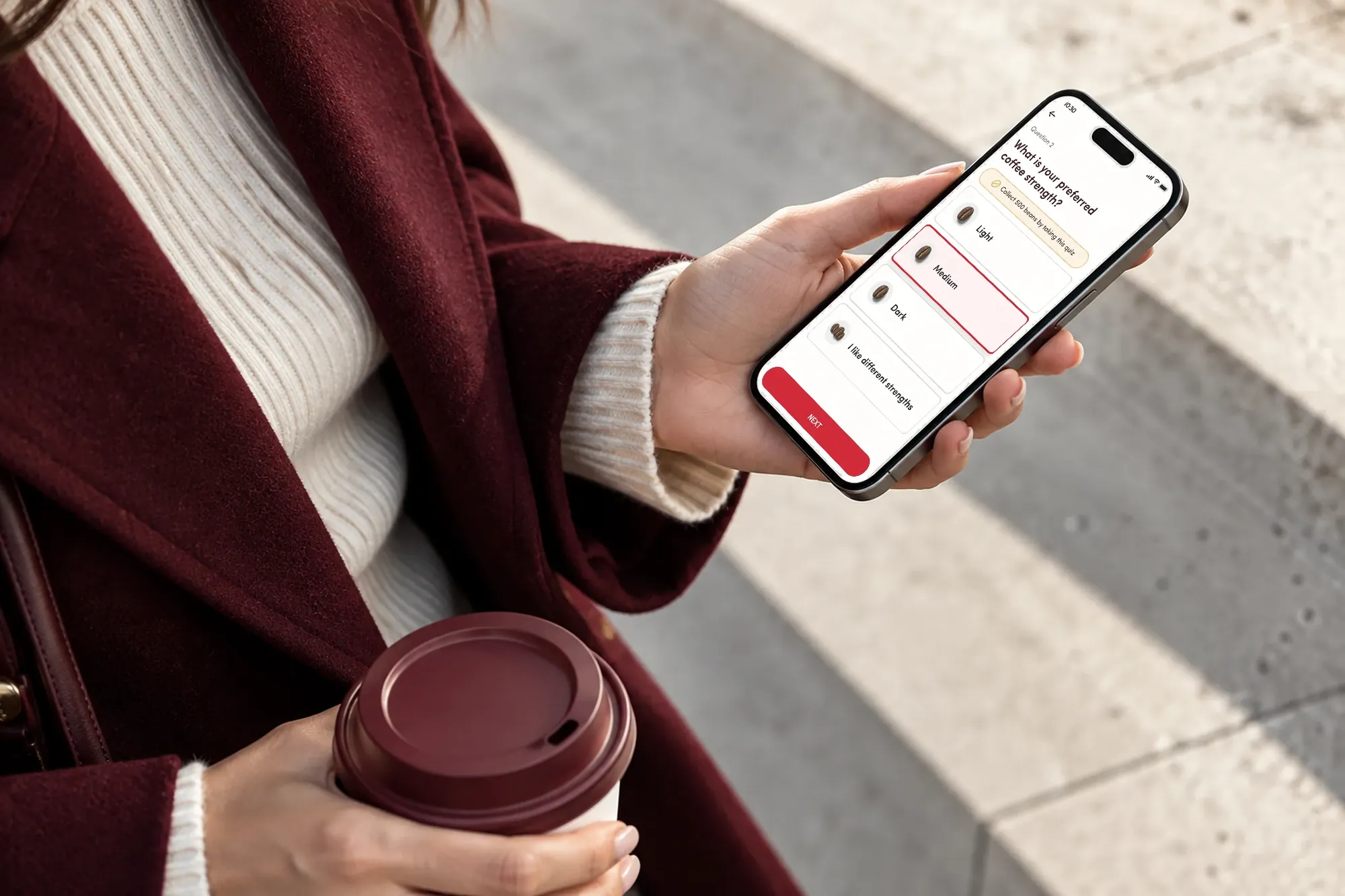 Tim Hortons quiz question about coffee strength on a phone held outdoors